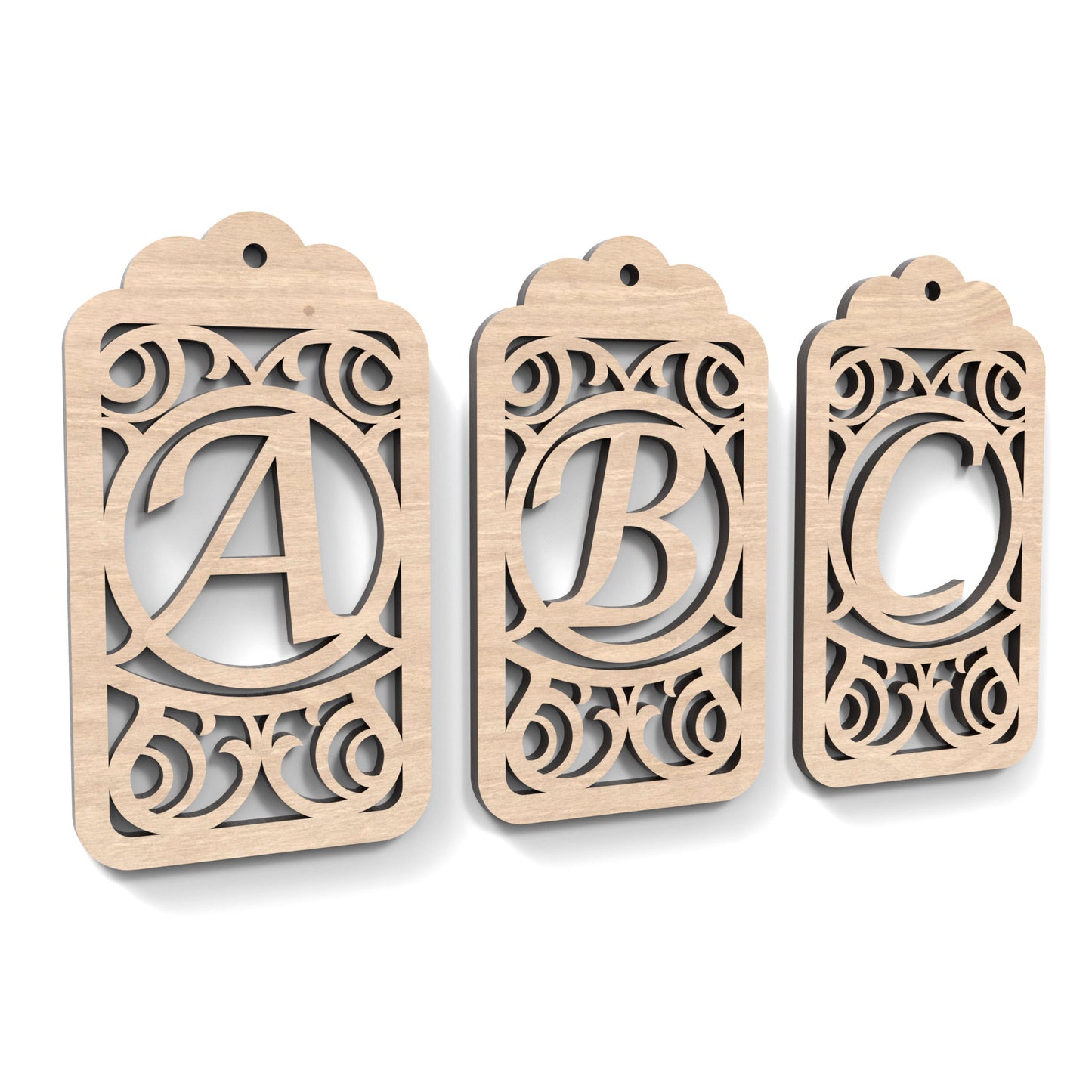 A B C of Monogram Gift Tags made from our laser cutting files and available as a digital download. Each gift tag features a separate letter cut out of its centre.
