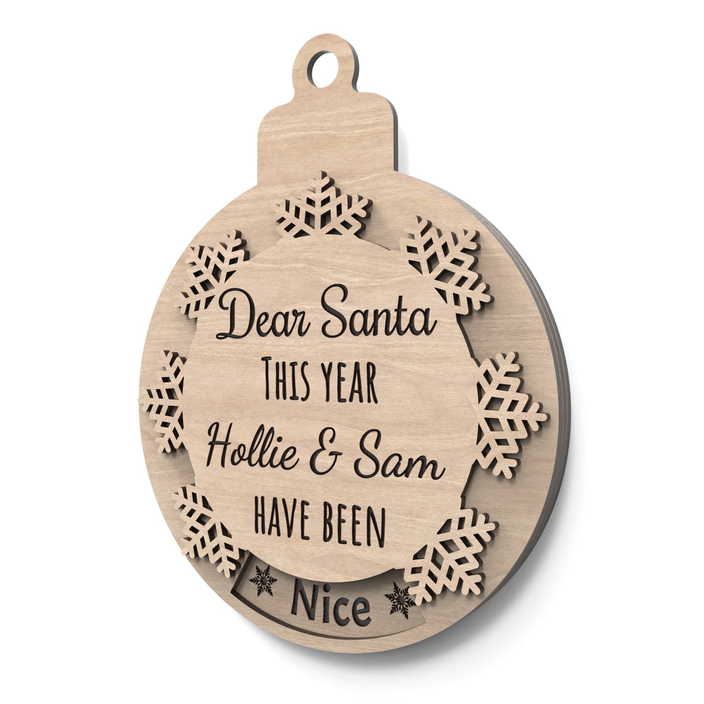 Naughty or Nice Christmas bauble made from our laser cutting files and available for digital download. Features a rotating snowflake that alternates between 'Nice' and 'Naughty' through a cut-out window. Includes the phrase 'Dear Santa, This Year,' space for a personalized name, and 'Have Been' followed by 'Naughty' or 'Nice'.