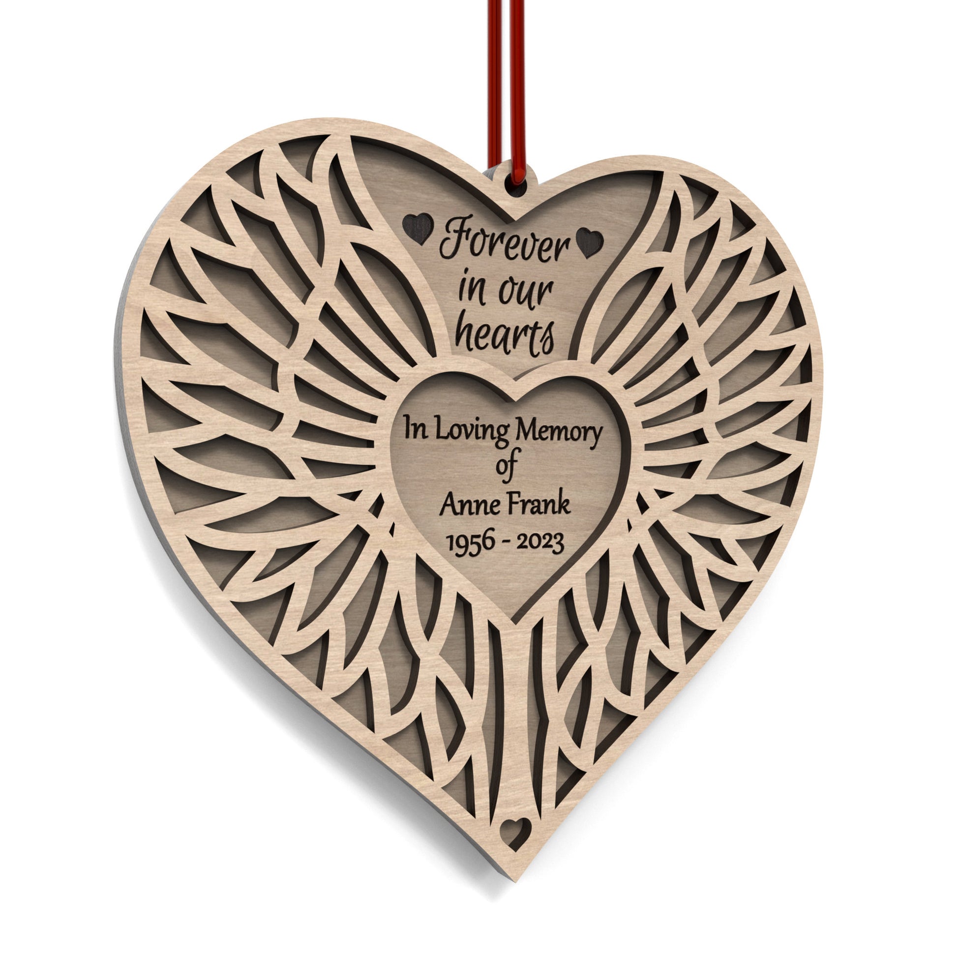 Angel Wing Heart Memorial Ornament made from our laser cutting files and available for digital download. Features two heart-shaped layers symbolizing love and remembrance: the back layer offers space for a personal message, name, and dates, while the front layer, adorned with angel wings, represents eternal guardianship.