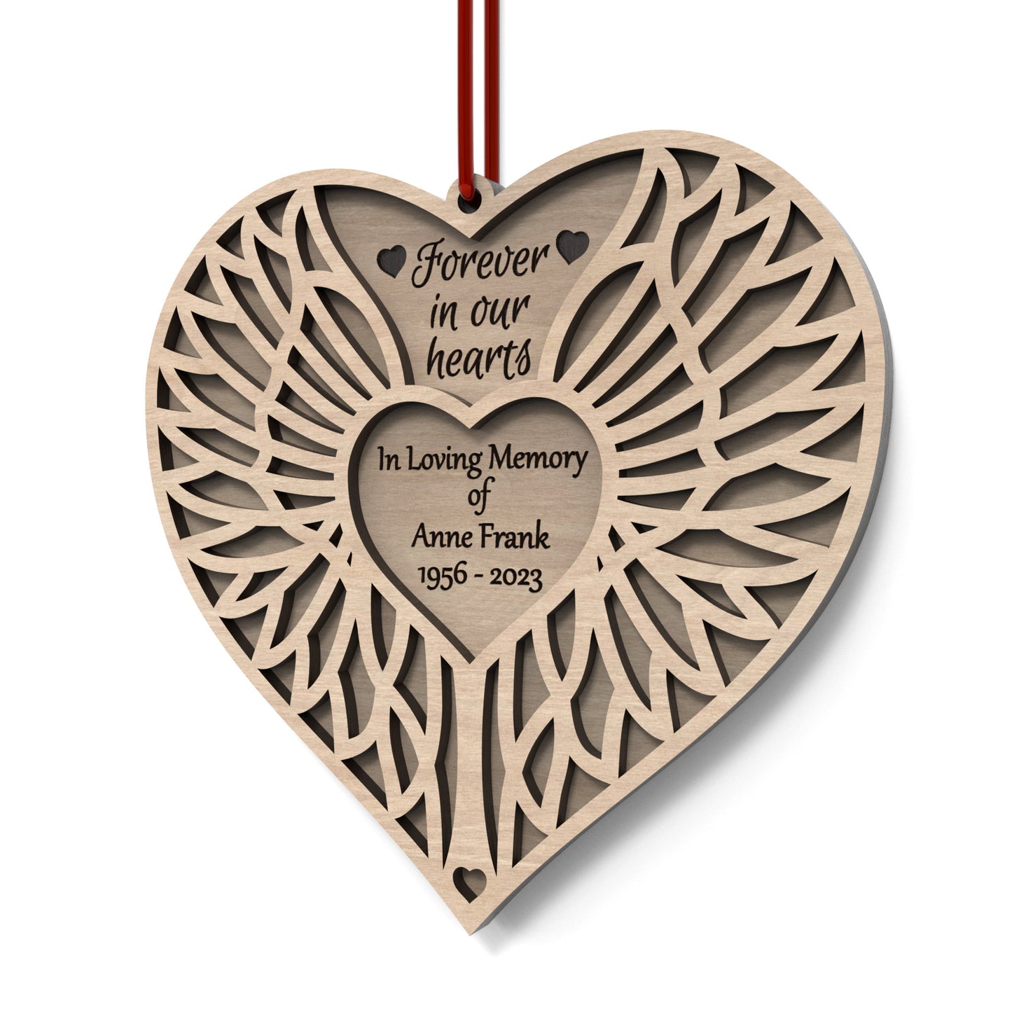 Angel Wing Heart Memorial Ornament made from our laser cutting files and available for digital download. Features two heart-shaped layers symbolizing love and remembrance: the back layer offers space for a personal message, name, and dates, while the front layer, adorned with angel wings, represents eternal guardianship.