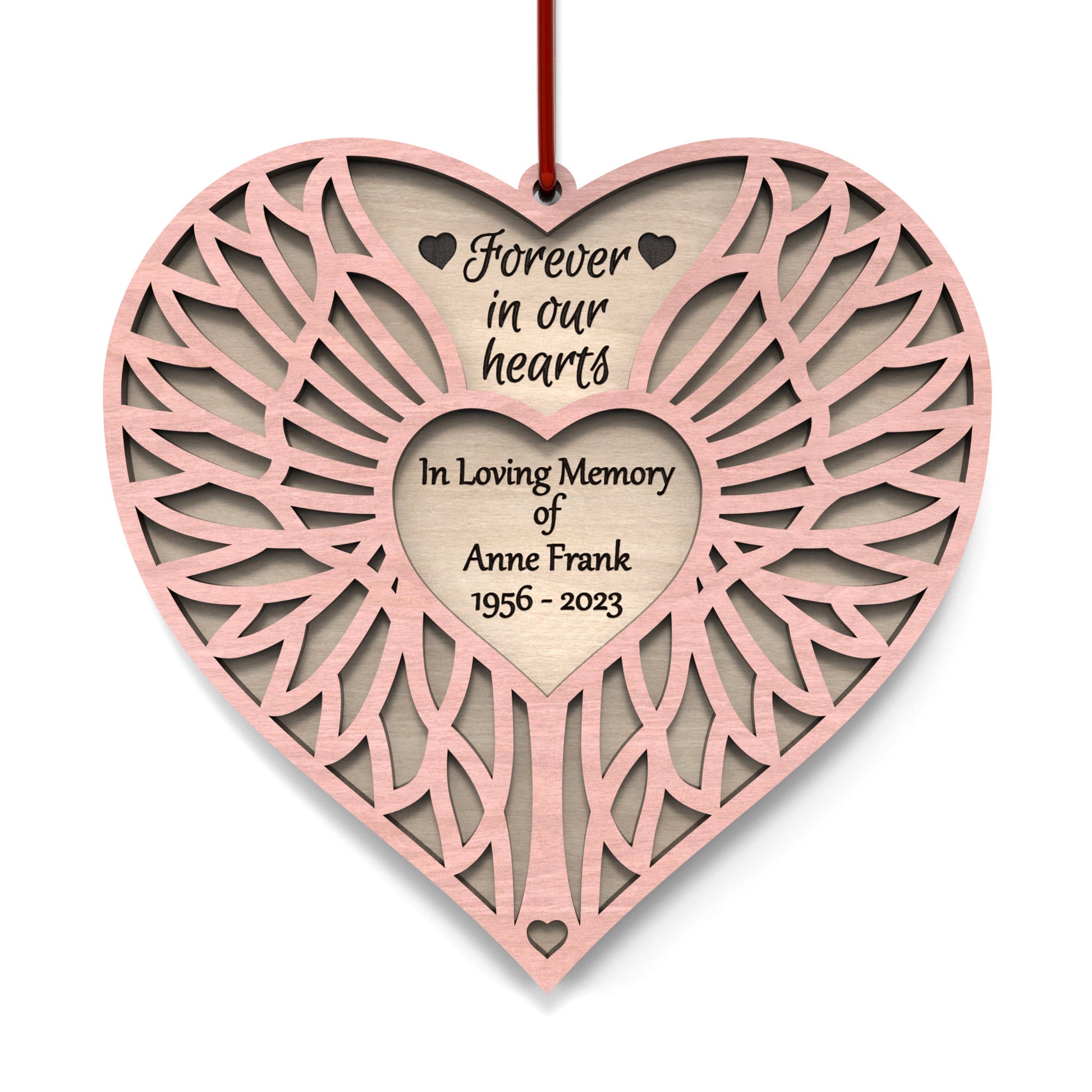 Angel Wing Heart Memorial Ornament made from our laser cutting files and available for digital download. Features two heart-shaped layers symbolizing love and remembrance: the back layer offers space for a personal message, name, and dates, while the front layer, adorned with angel wings, represents eternal guardianship.