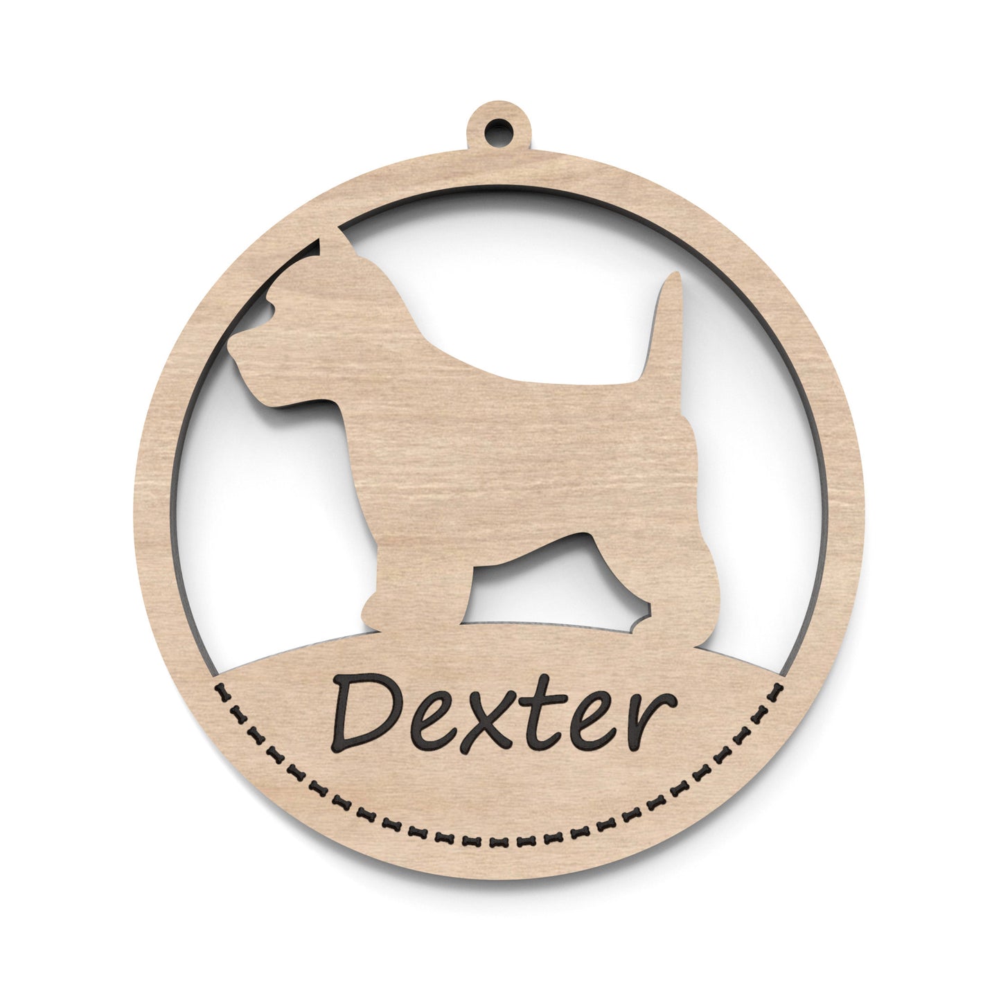 A dog bauble ornament made from our laser cutting files and available for digital download. The ornament features a circular bauble shape with a silhouette of your favourite dog breed in the centre and a space at the bottom for personalization.