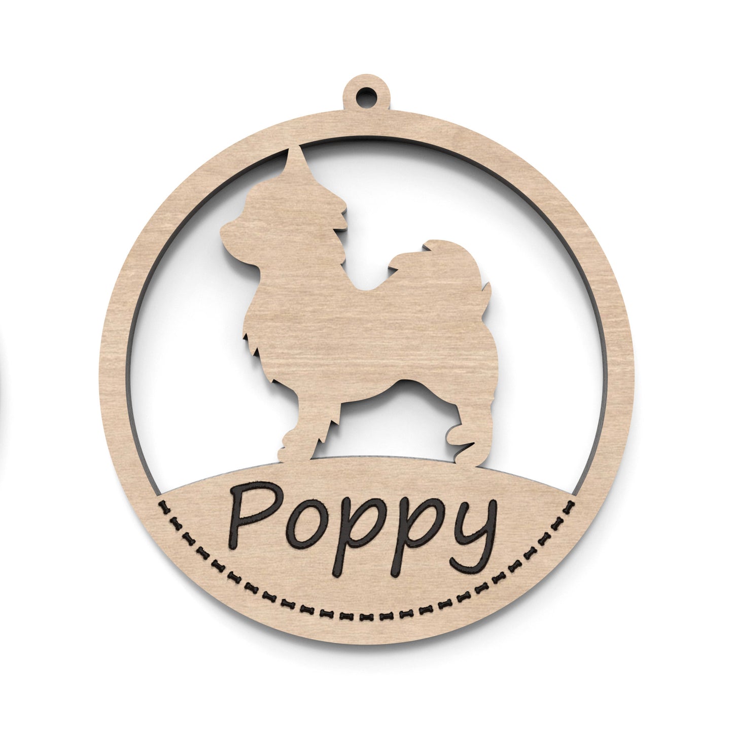 A dog bauble ornament made from our laser cutting files and available for digital download. The ornament features a circular bauble shape with a silhouette of your favourite dog breed in the centre and a space at the bottom for personalization.