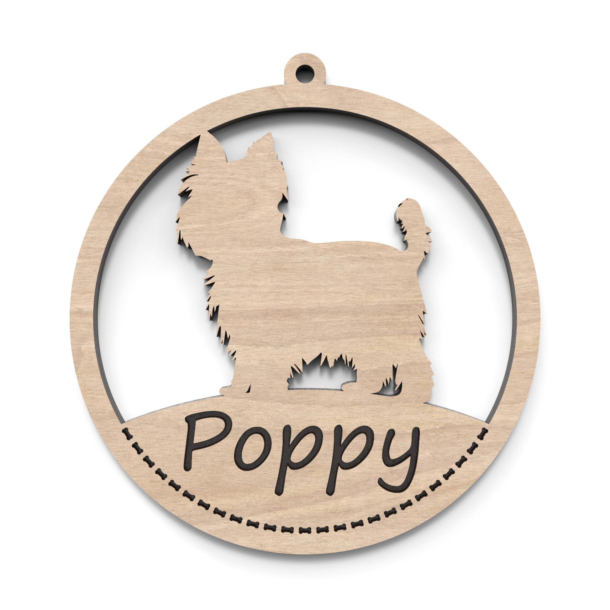 A dog ornament bauble made from our laser cutting files and available for digital download. Each ornament features a circular bauble shape with a silhouette of your favourite dog breed in the centre and a space at the bottom for personalization.