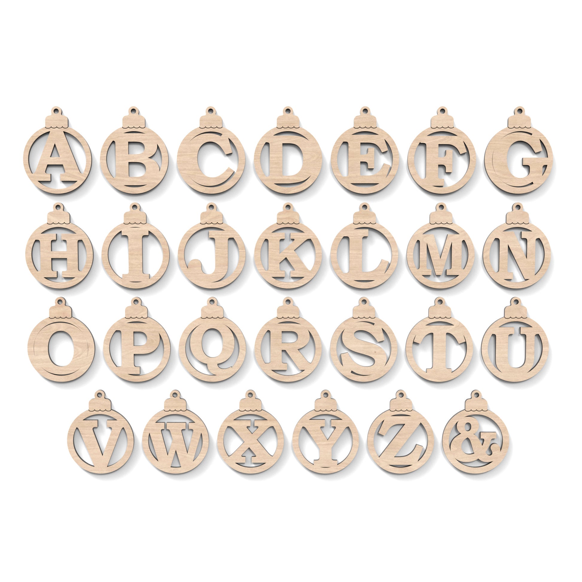 The full alphabet A-Z of Christmas Tree Baubles made from our laser cutting files and available for digital download. Each bauble features a separate letter cut out of its centre.