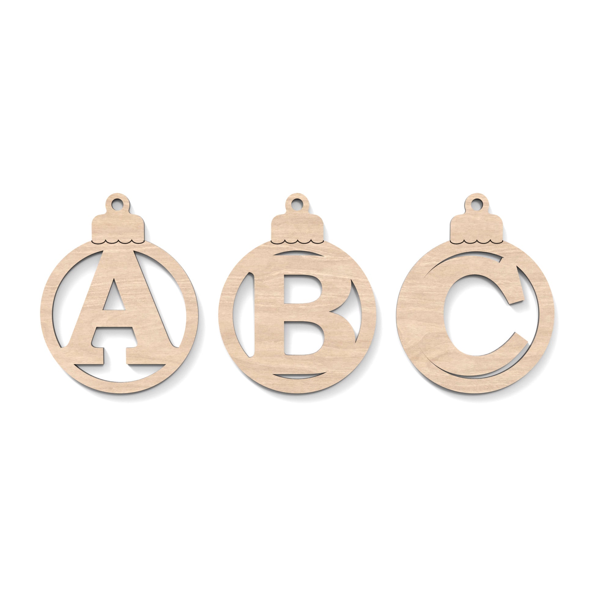  A B C Christmas Tree Baubles made from our laser cutting files and available for digital download. Each bauble features a separate letter cut out of its centre.