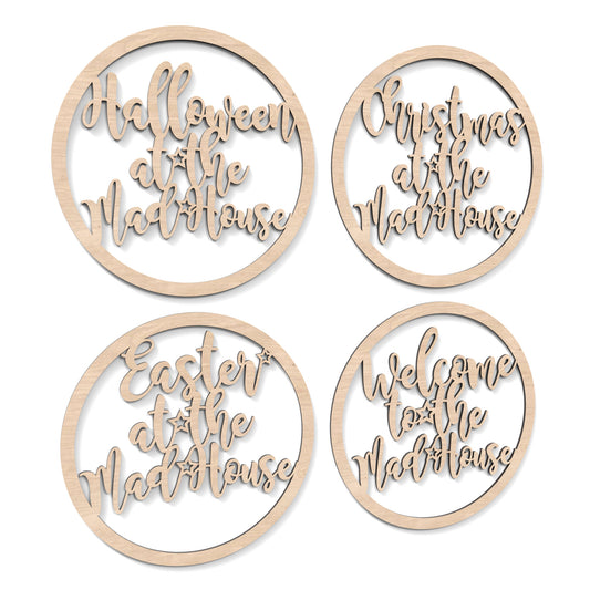 Welcome, Easter, Halloween and Christmas at the Madhouse Hoop Signs Wall Art made from our laser cutting files and available as a digital download. Each hoop features wording cut out of its centre with either "Welcome," "Easter," "Halloween," or "Christmas" followed by "at the Madhouse.