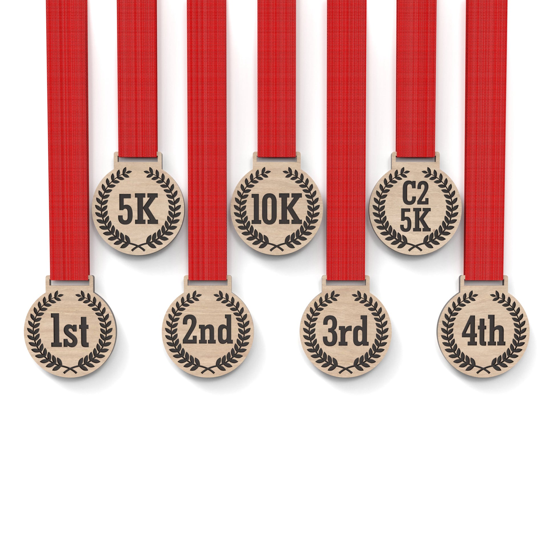 Set of 8 running medals made from our laser cutting files and available for digital download. Each medal is 6cm wide with a slot for a 2.5cm ribbon at the top and features engraving for 5K, 10K, C25K, and 1st to 5th place.