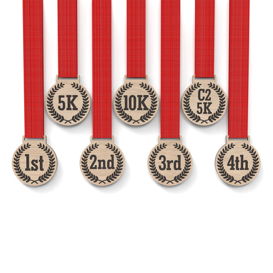 Set of 8 running medals made from our laser cutting files and available for digital download. Each medal is 6cm wide with a slot for a 2.5cm ribbon at the top and features engraving for 5K, 10K, C25K, and 1st to 5th place.