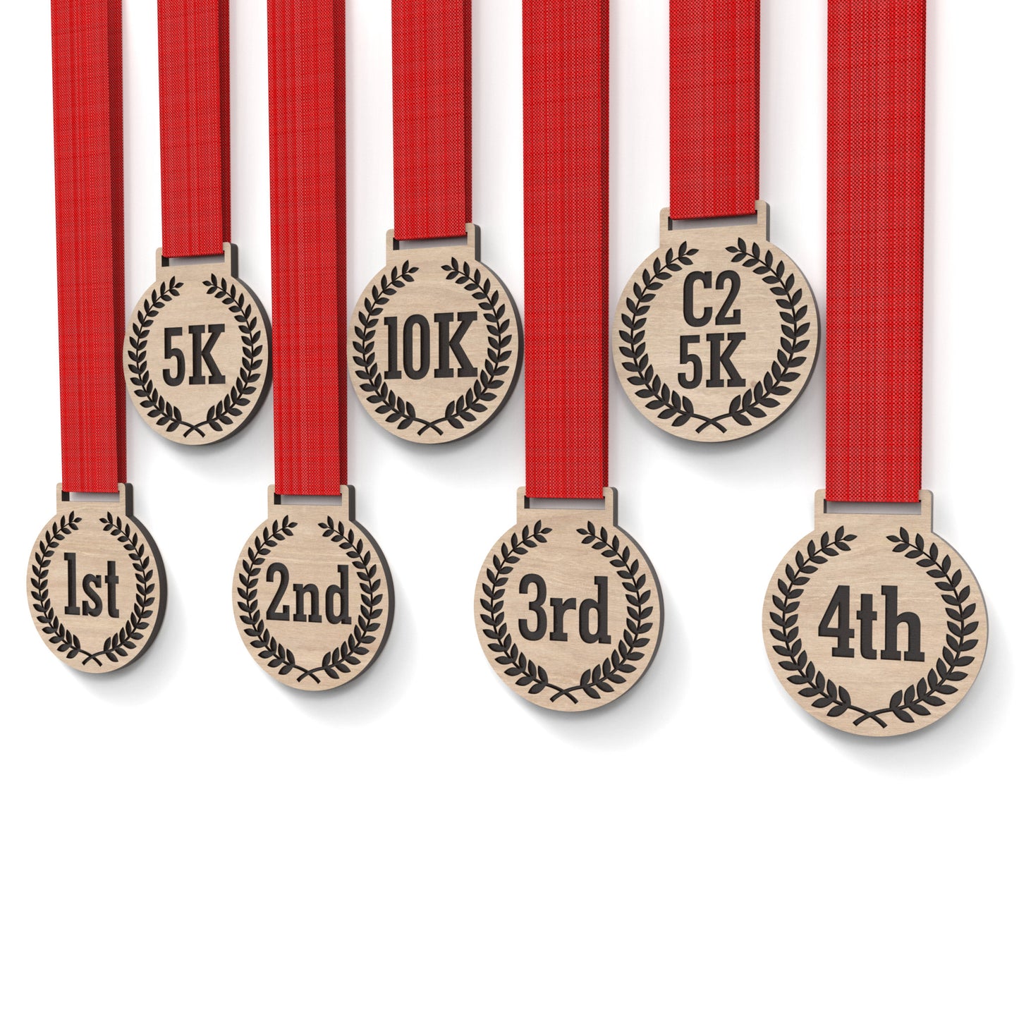 Set of 8 running medals made from our laser cutting files and available for digital download. Each medal is 6cm wide with a slot for a 2.5cm ribbon at the top and features engraving for 5K, 10K, C25K, and 1st to 5th place.
